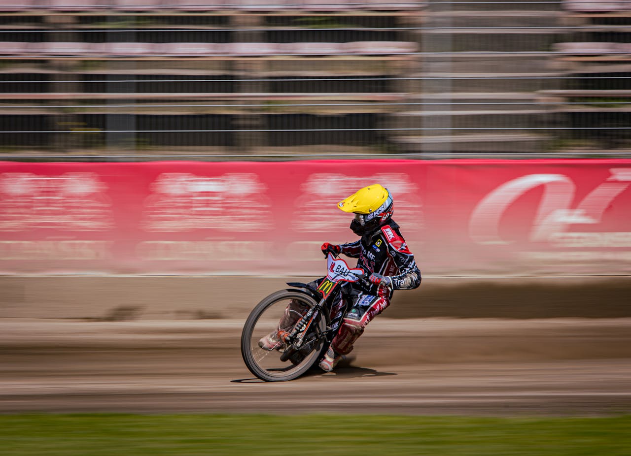 A person riding a dirt bike on a track